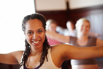 Buy stock photo Woman in yoga fitness studio, exercise pilates in training class and wellness motivation. Black lady happy workout, muscle floor stretching in group gym class and coach practice self care together