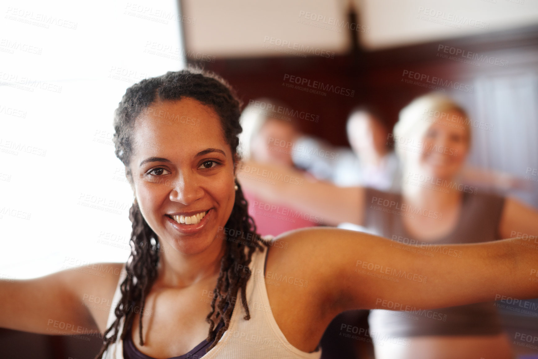 Buy stock photo Woman in yoga fitness studio, exercise pilates in training class and wellness motivation. Black lady happy workout, muscle floor stretching in group gym class and coach practice self care together