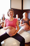 Enjoying a pregnancy pilates class 