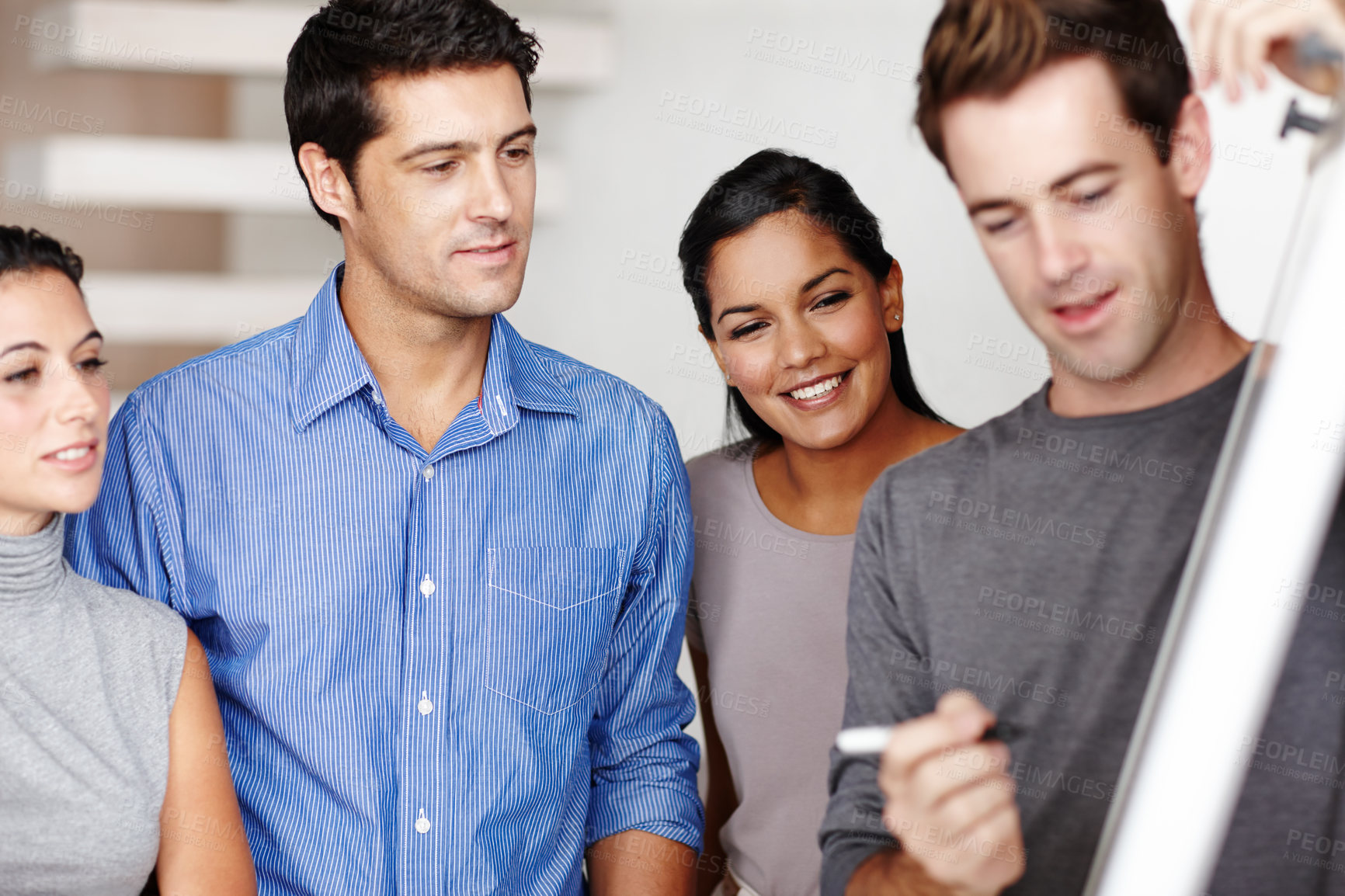 Buy stock photo A team of architects collaborating on a project together