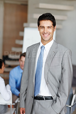 Buy stock photo A young executive smiling at you confidently