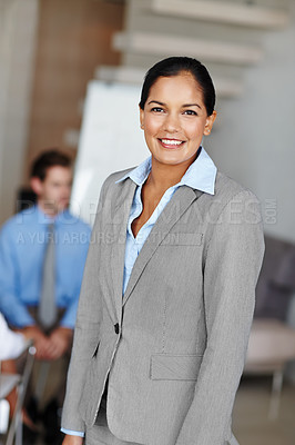 Buy stock photo Portrait of a confident businesswoman smiling in the office