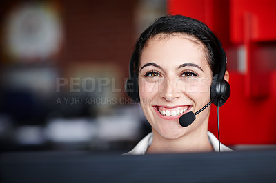 Buy stock photo Portrait of a pretty call center agent wearing a headset and sitting in front of her computer