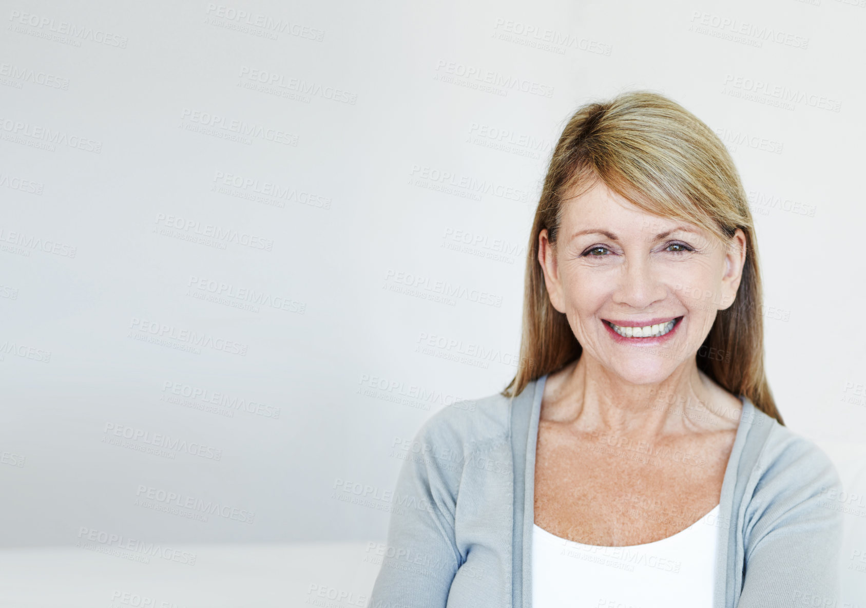 Buy stock photo Smile, confident and portrait of senior woman in studio with mockup space for retirement. Face, pride and mature female person from Australia with happiness for pension with white background.