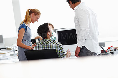 Buy stock photo A group of colleagues working in the office together