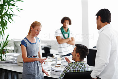 Buy stock photo A group of colleagues working in the office together