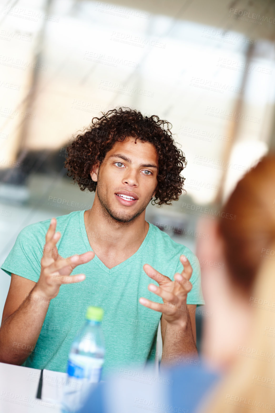 Buy stock photo Young colleagues having a meeting in the office