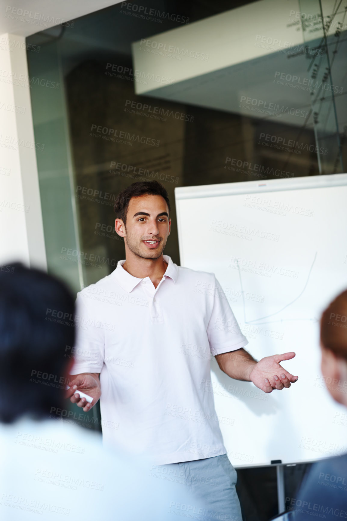 Buy stock photo Businessman, presentation and meeting with whiteboard for training staff, project or discussion at office. Young man or speaker talking to employees for company growth, profit or revenue at workplace