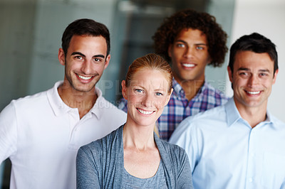 Buy stock photo A group of casual business people standing together and smiling