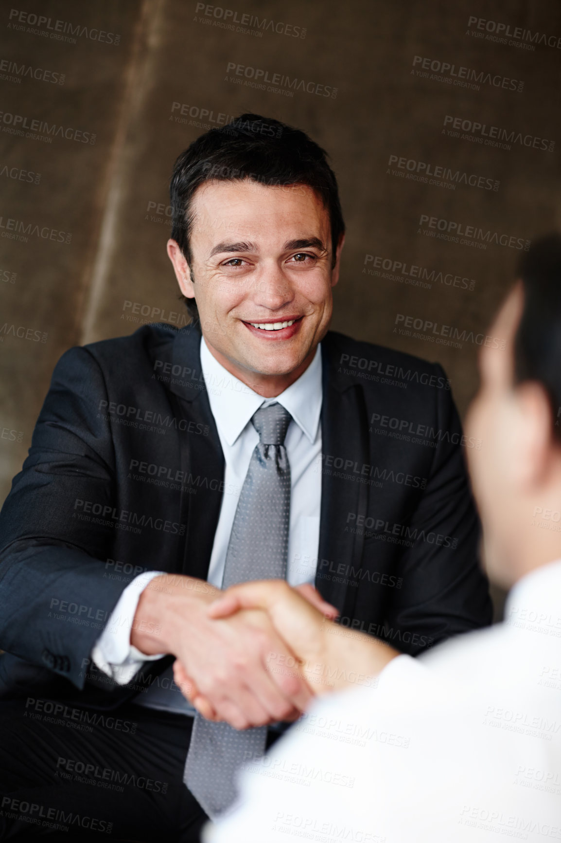 Buy stock photo Happy businessman, portrait and interview with handshake in meeting for partnership or deal at office. Young business people shaking hands in teamwork for agreement, recruiting or hiring at workplace