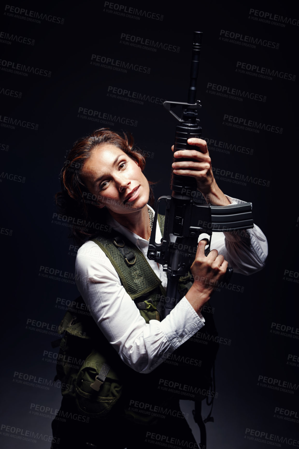 Buy stock photo Model, warrior and gun in studio with serious face for action, fight and danger safety. Female soldier, woman or agent in bulletproof vest, body armor or camouflage with weapon on dark background