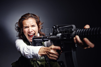 Buy stock photo Angry, shooting and woman with gun in studio for secret service, protection and security. Government, worker and special agent with assault rifle for firearm, mission and defense on gray background