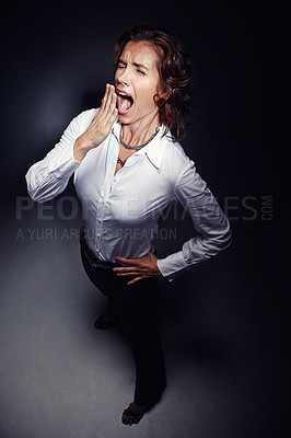 Buy stock photo Business woman, light and yawn for tired, burnout and overworked with bored, sleepy and late at night. Employee, spotlight and open mouth for fatigue, exhausted and overtime in evening with stress