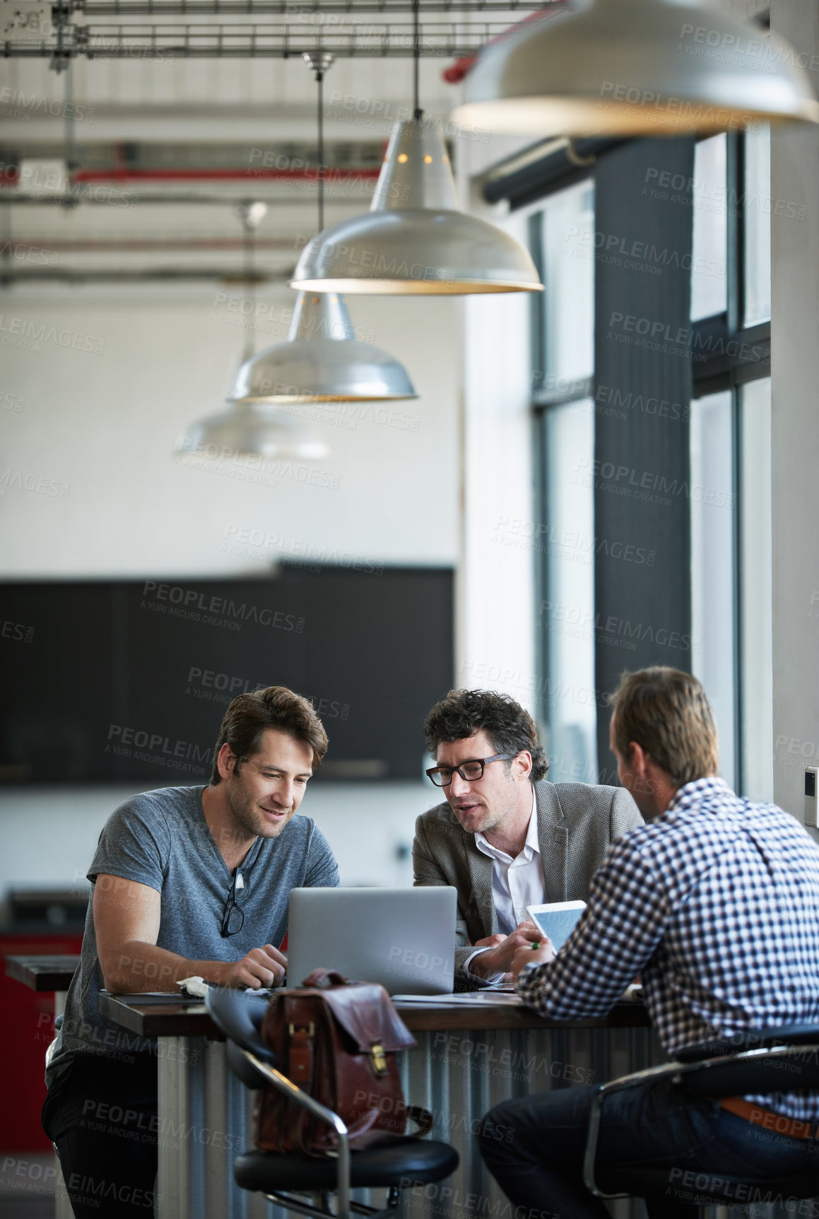 Buy stock photo Colleague, talking and laptop in office for web project, career and review online email feedback on digital report. Mature people or professional team with tech for research and planning on mockup