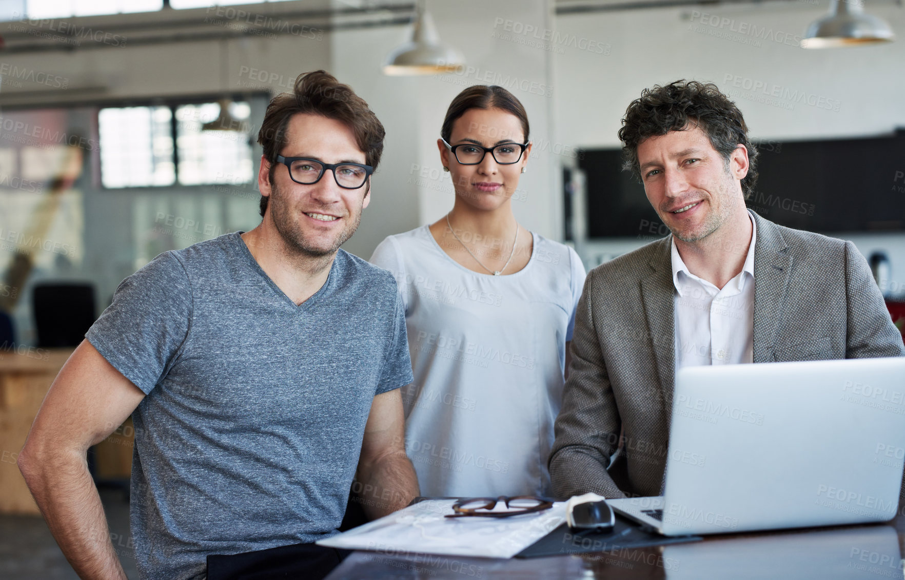 Buy stock photo Portrait, collaboration and laptop in office for meeting with happy people, agency and web design. Technology, teamwork and face of employees in workplace for creative startup, happiness and internet