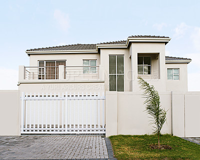 Buy stock photo Shot of a beautiful modern home - The house designs displayed represent a simulation of a real product and have been changed or altered enough by our team of retouching and design specialists so that they don't have any copyright infringements