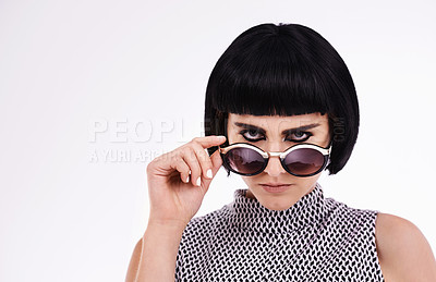 Buy stock photo Fashion, portrait and woman in studio for retro, trendy or vintage clothing with white background. Serious, confident and face of female model for aesthetic, designer sunglasses and stylish outfit