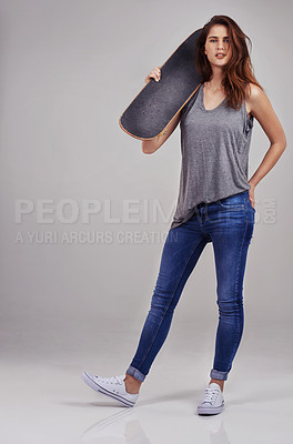 Buy stock photo Portrait, skateboard and woman in gray background for fashion with health, sports and workout. Long board, isolated and gen z model by studio with transport for exercise, clothes and sustainability