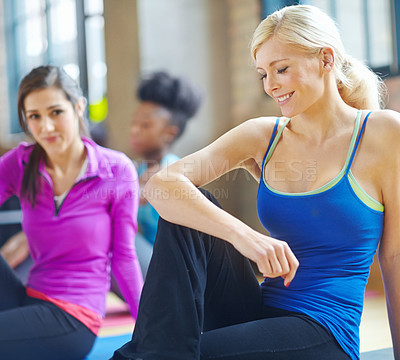 Buy stock photo Stretching, fitness and woman in pilates health class for training, exercise and warm up on floor. Smile, muscles and female person getting ready for flexibility workout, yoga or wellness