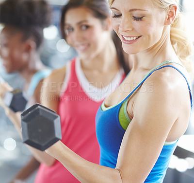 Buy stock photo Woman, dumbbell and gym exercise or weightlifting workout for bicep growth or muscle, arms or strong. Female person, friends and fitness training for wellness goals in group class, health or smile