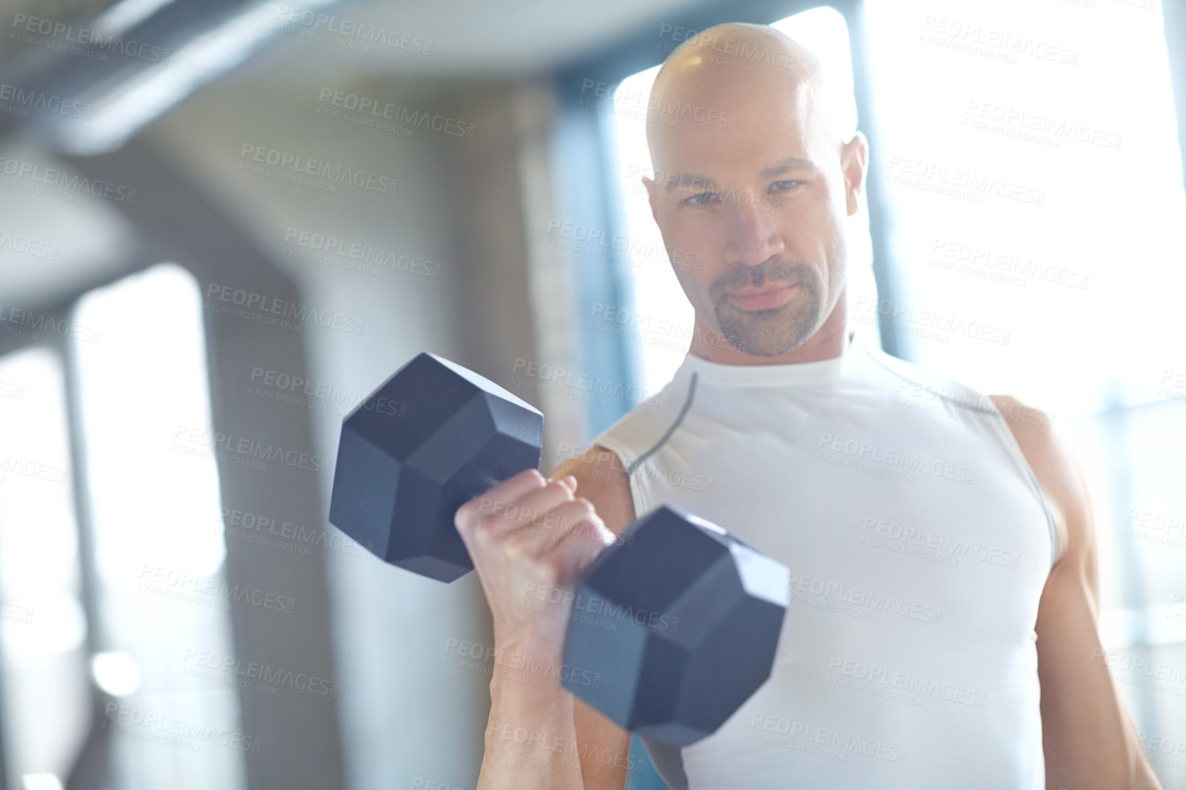 Buy stock photo Portrait, bodybuilder or serious man with dumbbell in workout, fitness training or exercise for grip power. Strong, bodybuilding or athlete with weights for pump, sports challenge or energy in gym