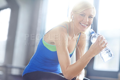 Buy stock photo Earphones, water and portrait of woman in gym listen to podcast, music or radio with hydration. Health, exercise and female athlete streaming song, album or playlist for workout in fitness center.