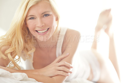 Buy stock photo Relax, carefree and portrait of happy woman on bed with smile, morning health or wellness on weekend in home. Wake up, underwear and girl in bedroom for rest, comfort or fresh start to day in Germany