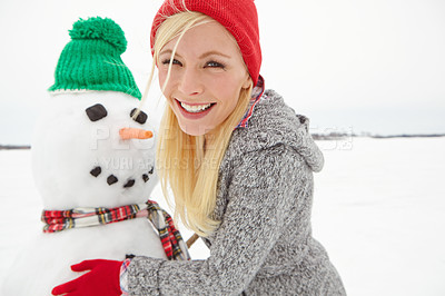 Buy stock photo Christmas, holiday and woman with snowman in winter vacation portrait, happy building with snow and celebration. Festive spirit with Xmas tradition outdoor, happiness and celebrate with nature.