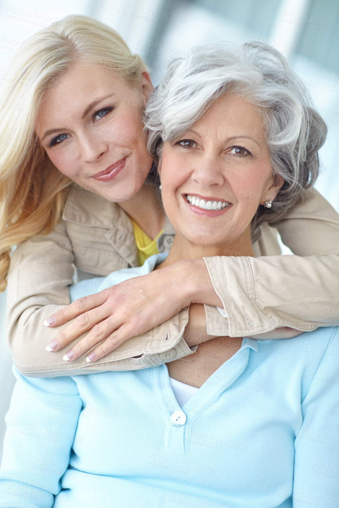 Buy stock photo Portrait, mom and woman hug in home to relax together with smile, love and wellness for affection. Mothers day, mature and happy daughter bonding in lounge with family, parent and support in Germany