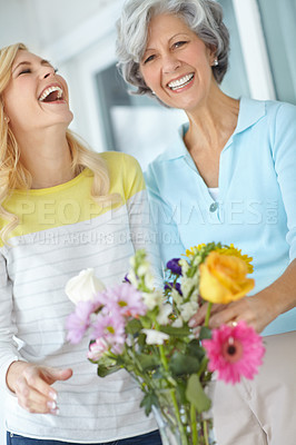 Buy stock photo Portrait, mom or happy woman laughing with flowers in house together with love or pride for gardening. Mothers day, senior or funny daughter bonding in home with family, parent or gift present in USA