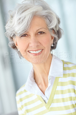 Buy stock photo Portrait of senior woman smiling with great teeth. Beautiful old female standing alone inside a room. Happy attractive mature lady with short hair. Pretty older person with good dental care