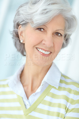 Buy stock photo Portrait of happy senior caucasian woman wearing earrings at home. Face and neck of cheerful retired lady showing benefits of collagen supplements to aid anti ageing, youthful skin and good dental