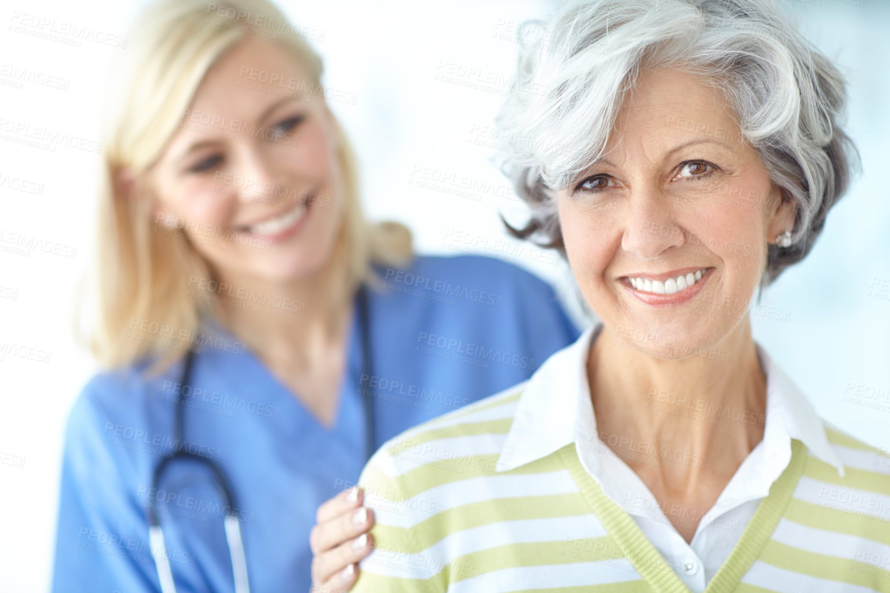Buy stock photo Mature woman, portrait or nurse with smile for healthcare support, empathy or hope at nursing home. Lady, help or friendly caregiver with patient, trust or happy person with medical service in clinic