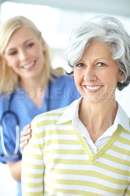 Buy stock photo Senior woman, portrait or nurse with smile for healthcare support, empathy or hope at nursing clinic. Consulting, help or friendly caregiver with patient, trust or happy person with medical service