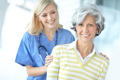 Buy stock photo Nurse, woman and mature portrait for trust, healthcare and hand on shoulder with medical worker in hospital. Appointment, checkup and caregiver for support with professional, patient and happy