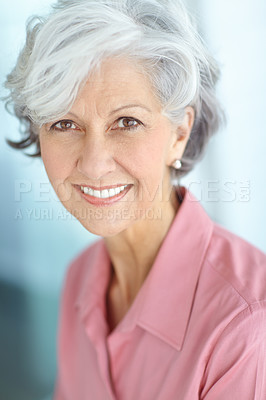 Buy stock photo Portrait of one happy senior caucasian woman with grey hair enjoying free time at home. Face of carefree, wise and cheerful retired lady smiling, feeling optimistic about life and ageing gracefully