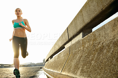 Buy stock photo Fitness, exercise and woman with running in road for cardio, challenge and training for marathon. Low angle, thinking and athlete with energy for outdoor sports, workout or endurance in San Fransisco