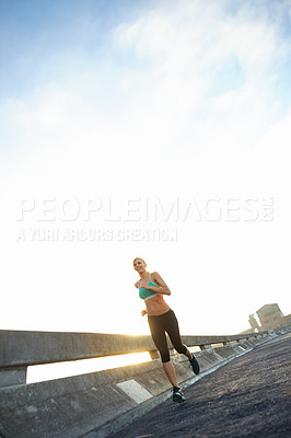 Buy stock photo Morning, exercise and woman with running in road for cardio, training and outdoor workout. Happy, smile and runner with challenge in street for sports, endurance and body health in San Fransisco