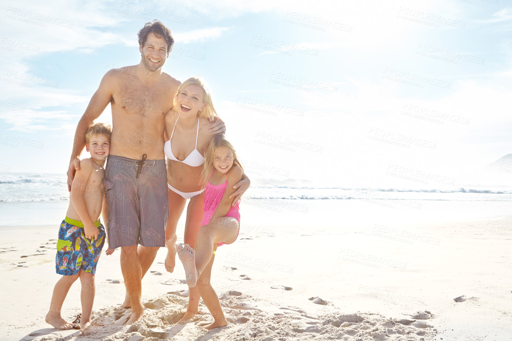 Buy stock photo Portrait, beach and happy family on vacation together for summer holiday, travel and mockup space. Mother, father and kids at ocean for adventure, support and funny parents laughing with children