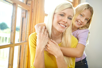 Buy stock photo Happy mother, portrait and child with hug for embrace, love or support in bonding, holiday or weekend together at home. Mom, daughter or young kid with smile in relax by window for care or comfort