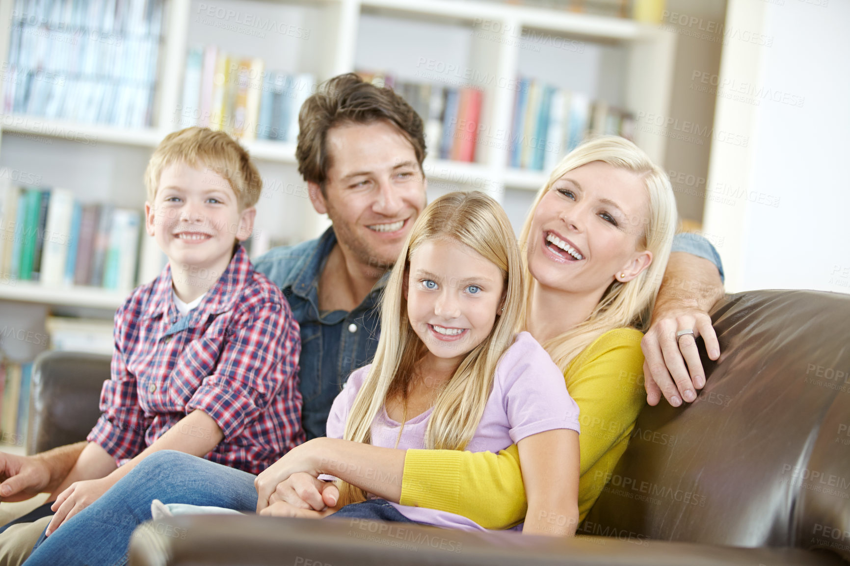 Buy stock photo Happy family, portrait and laughing on sofa in home with bonding, funny joke and resting on weekend. Parents, children and smile on couch in living room with love, care and relax in lounge of house