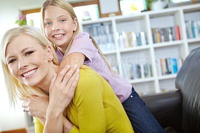 Buy stock photo Portait of a loving mother and daughter at home