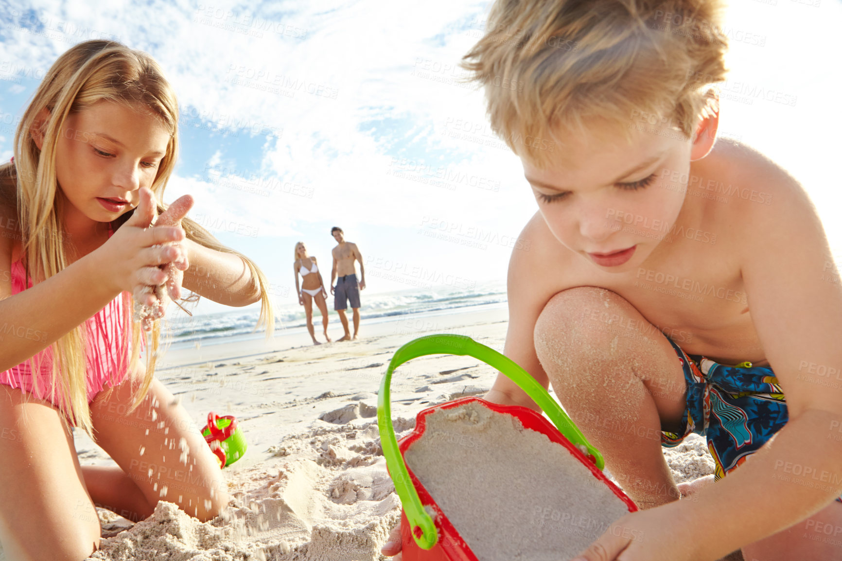 Buy stock photo Children, sand and together at beach for holiday, adventure and travel for family vacation in summer. Boy, girl and parents in nature with play, sunshine and development in Thailand by ocean