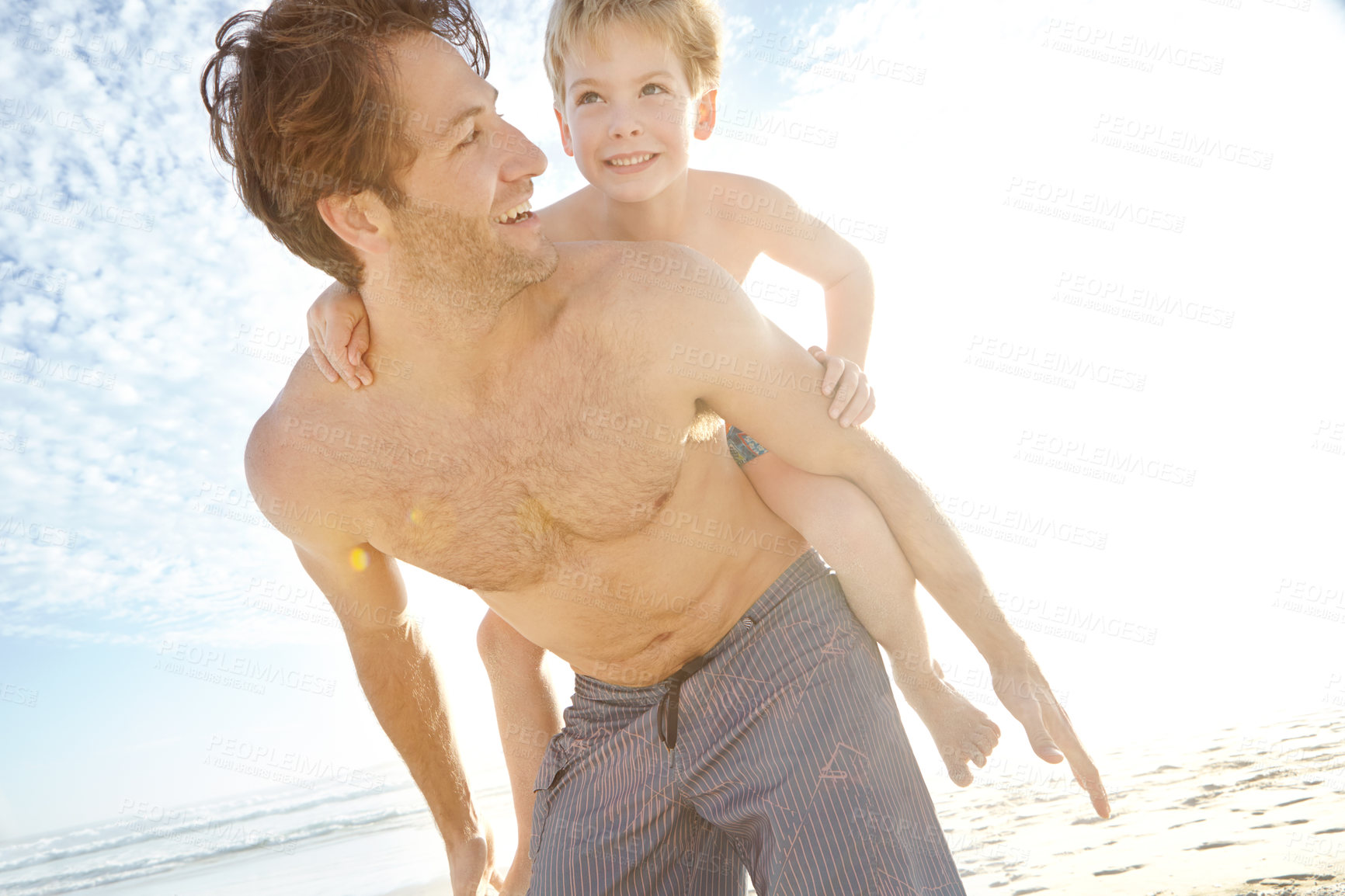 Buy stock photo Dad, boy and smile in beach with piggyback on holiday in summer, bonding and support in Miami. Parent, kid and happy or excited with fun at seaside on vacation, trip and travel for child development