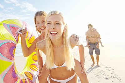 Buy stock photo Happy, mother and girl with back ride at beach for bonding, support and growth on summer holiday in Bali. Excited, family and children with smile and inflatable for playing together on vacation 