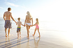 Family bonding on a sunlit beach
