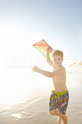 Buy stock photo Ocean, boy and running with kite for playing, childhood development and growth with sports outdoor. Beach, seaside and happy child on vacation, holiday and adventure in California with fun activity