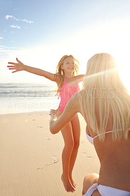 Buy stock photo Jump, girl or kid with mother on beach for vacation, holiday and weekend trip in California. Outdoor, ocean and seaside with happy family, mom and daughter relationship in summer for bonding