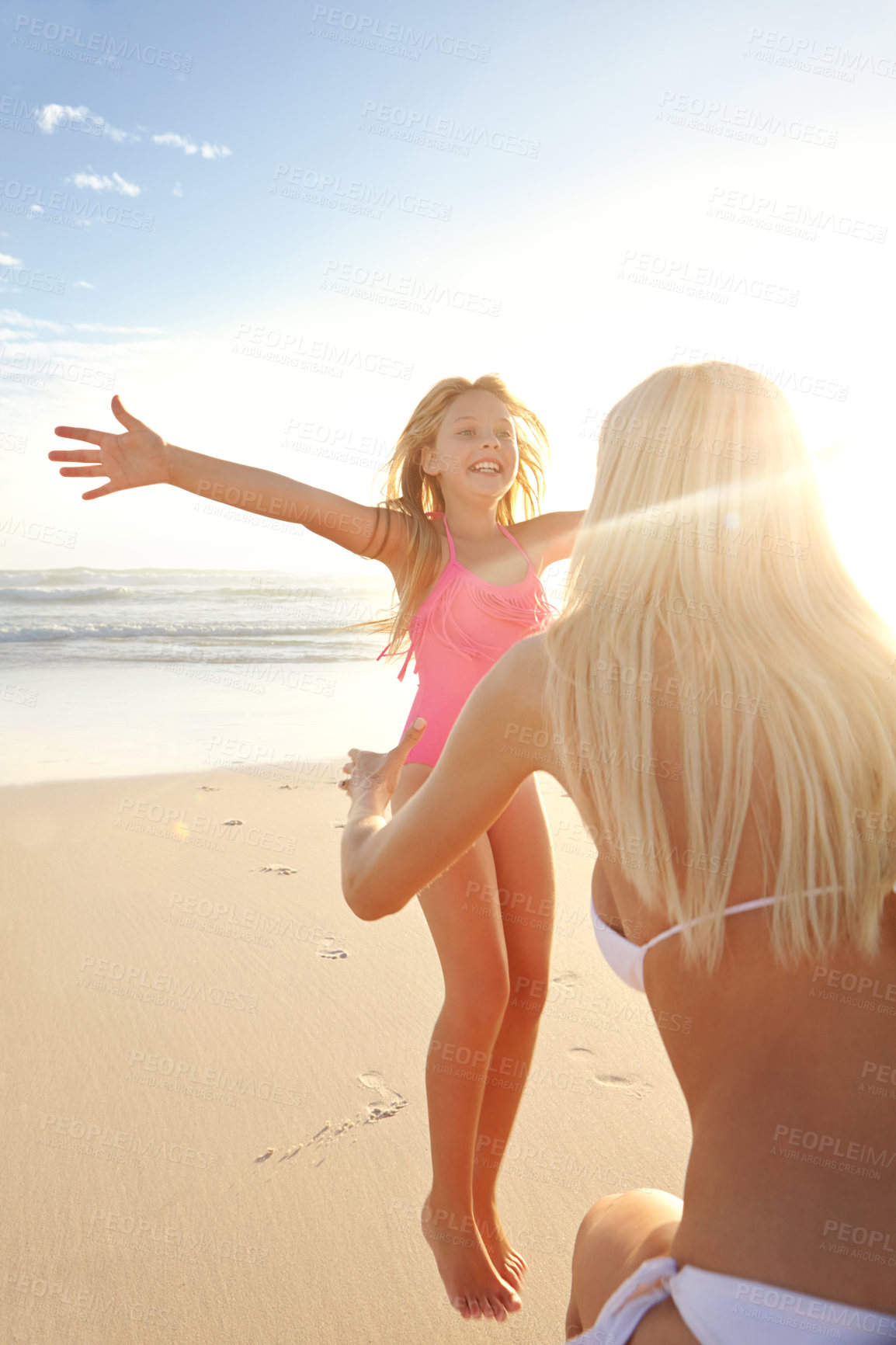 Buy stock photo Jump, girl or kid with mother on beach for vacation, holiday and weekend trip in California. Outdoor, ocean and seaside with happy family, mom and daughter relationship in summer for bonding