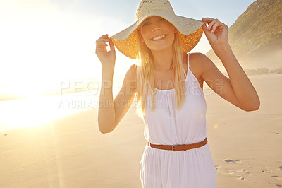 Buy stock photo Sunset, portrait and happy woman for walk on beach with hat, travel and adventure in nature. Female person, vacation and smile with pride for holiday, summer and sunshine on island in Thailand 